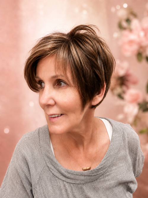 A soft, feminine pixie designed to flatter mature hair without feeling severe. The longer layers thr(..)