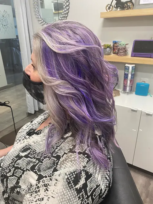 She wanted something fun and youthful, so we blended silver lavender hair with dimensional purple to(..)