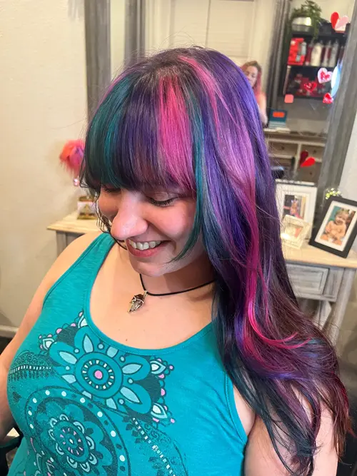 Love bold hair? This custom Denver fashion color features vibrant shades of magenta, violet, teal, e(..)