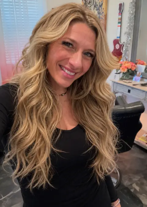 Chelsy Binyon styling hair at Lioness Hair Design